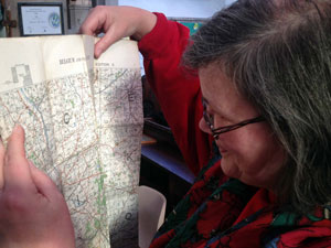 Kate holding a map